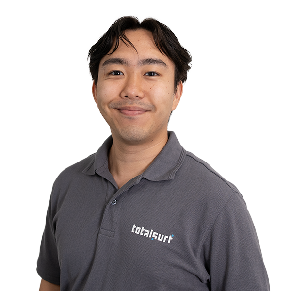 Person wearing a grey "totalsurf" polo shirt standing against a plain white background.